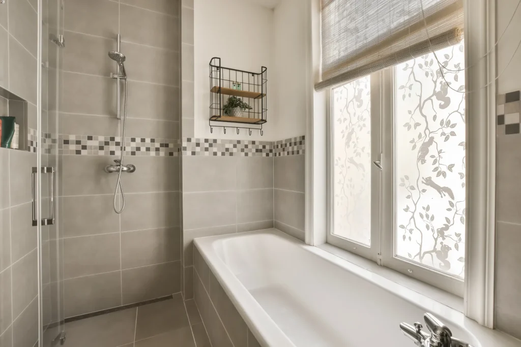 a bathroom with a bath tub and a window
