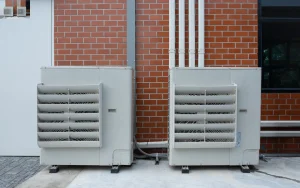 air compressor or condenser unit installed outside the house
