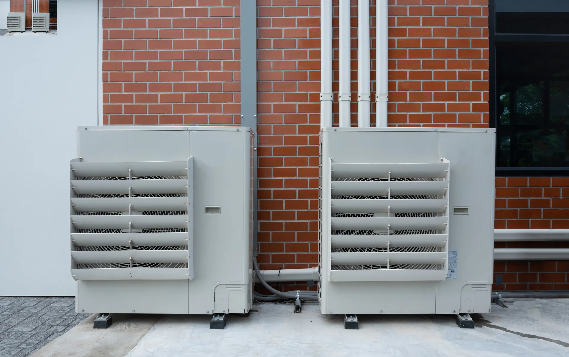 air compressor or condenser unit installed outside the house