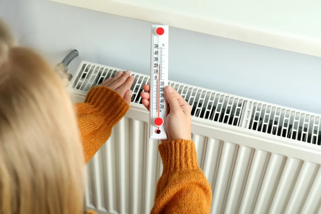 girl holding thermometer