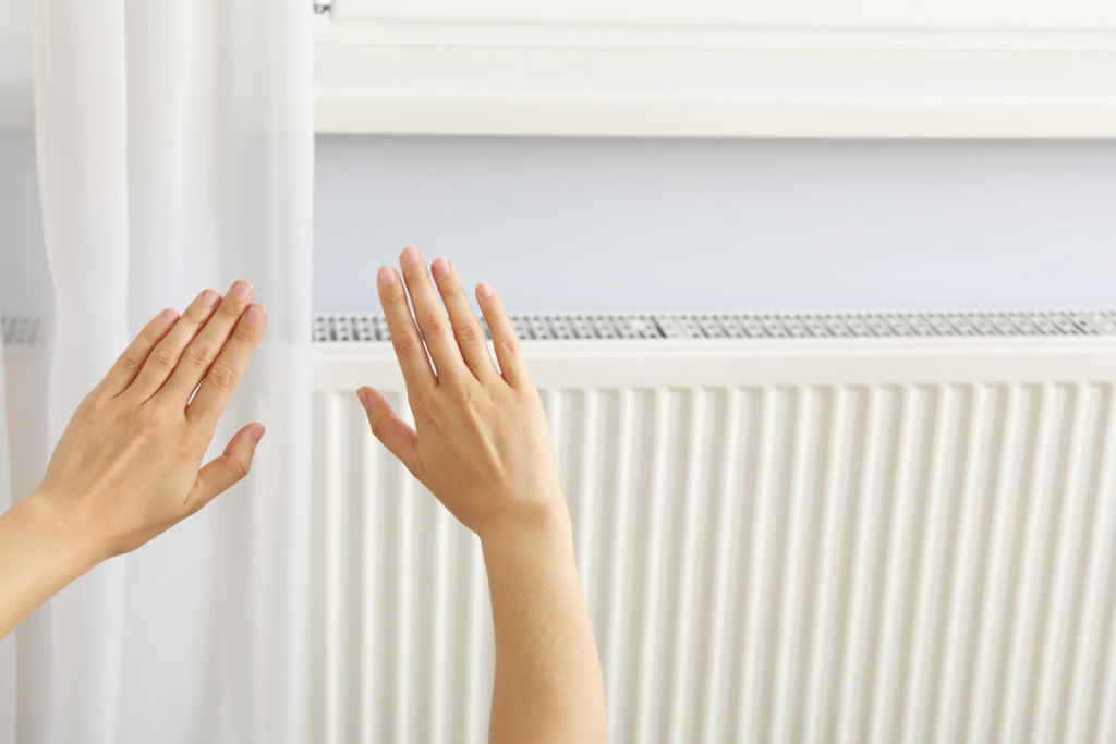 hands feeling the heat