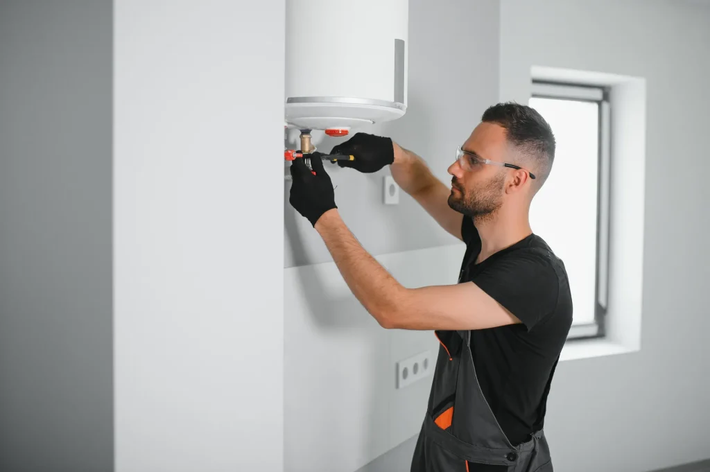 professional plumber checking a boiler