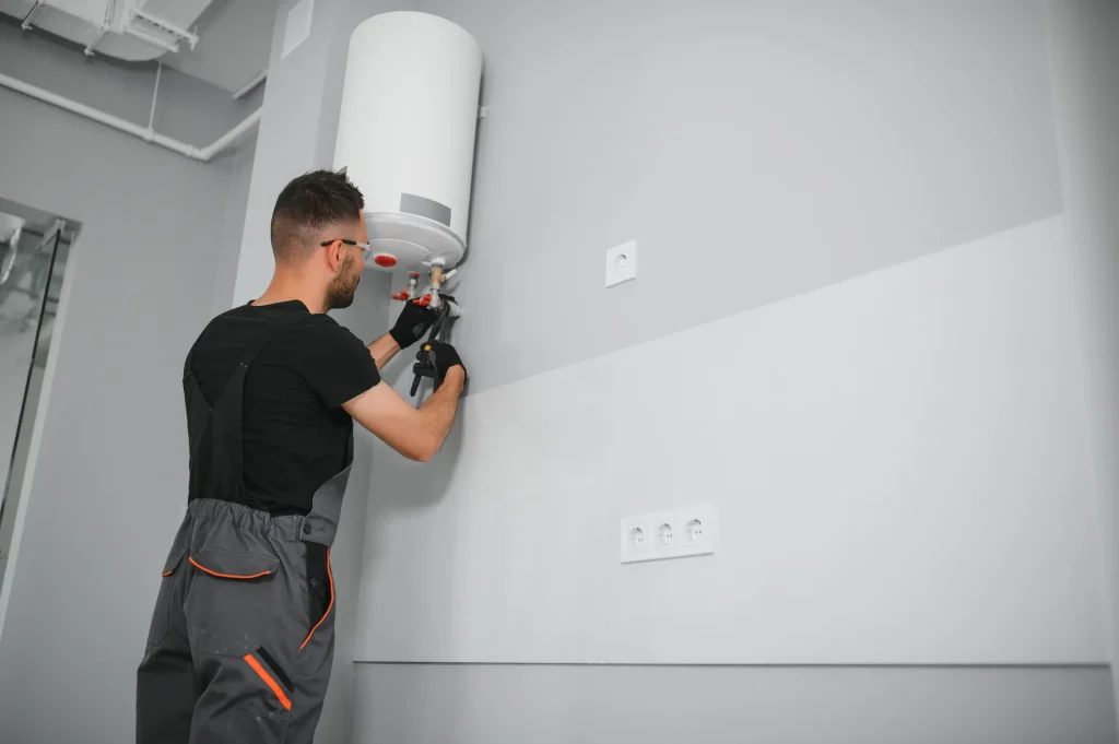 professional plumber checking a boiler and pipes
