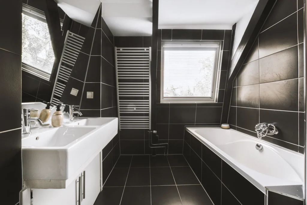 sinks and bathtub near shower cabin